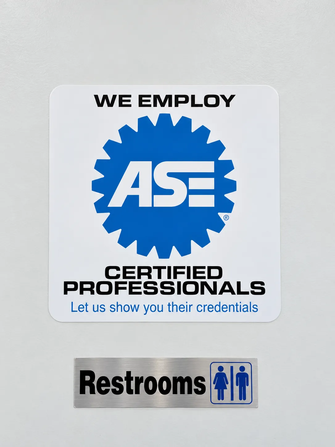 'We Employ ASE Certified Professionals' sign on the wall at Cedillo's auto repair in Fullerton