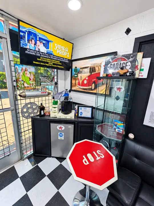 TV, garage decor and stop-sign table in the Cedillo's customer lounge in Fullerton