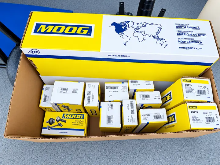 Box of new MOOG suspension and chassis parts delivered to Cedillo's auto repair in Fullerton
