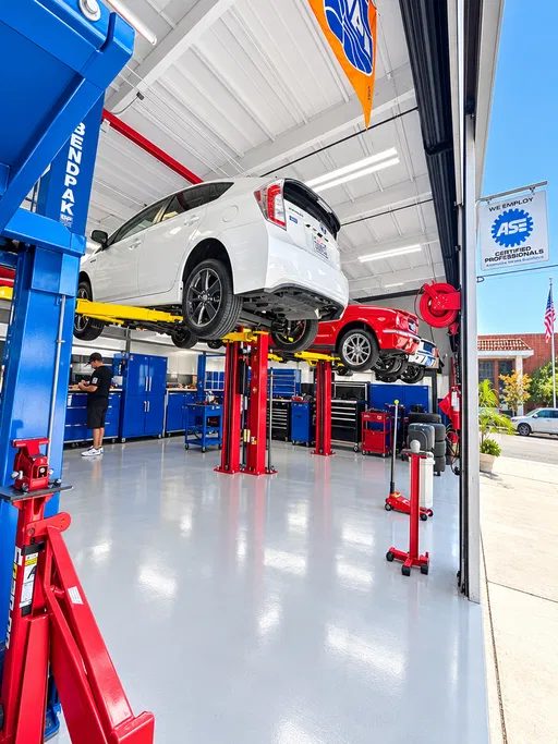 Service bays with the ASE Certified Professionals sign at Cedillo's