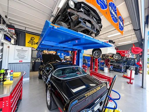 Pontiac Trans Am on a lift in the service bay at Cedillo's, Fullerton
